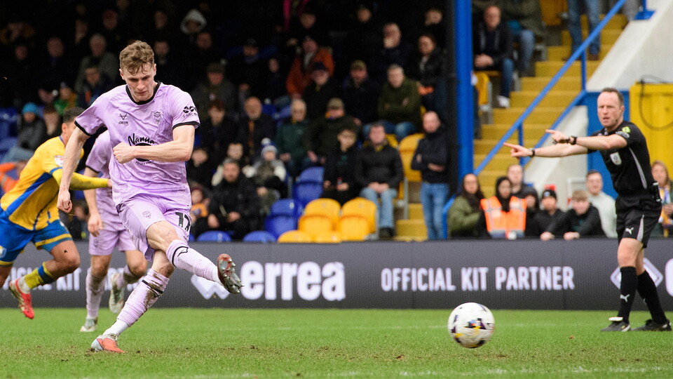 Rob Street scores a penalty for City at Mansfield