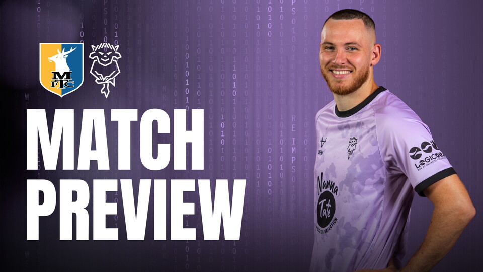 Smiling football player in a violet kit with black trim stands beside bold white text reading 'Match Preview' on a violet binary code backdrop. Logos of Mansfield Town and Lincoln City are displayed above the text