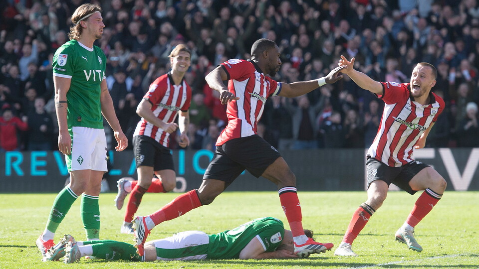 City celebrate scoring against Stockport County