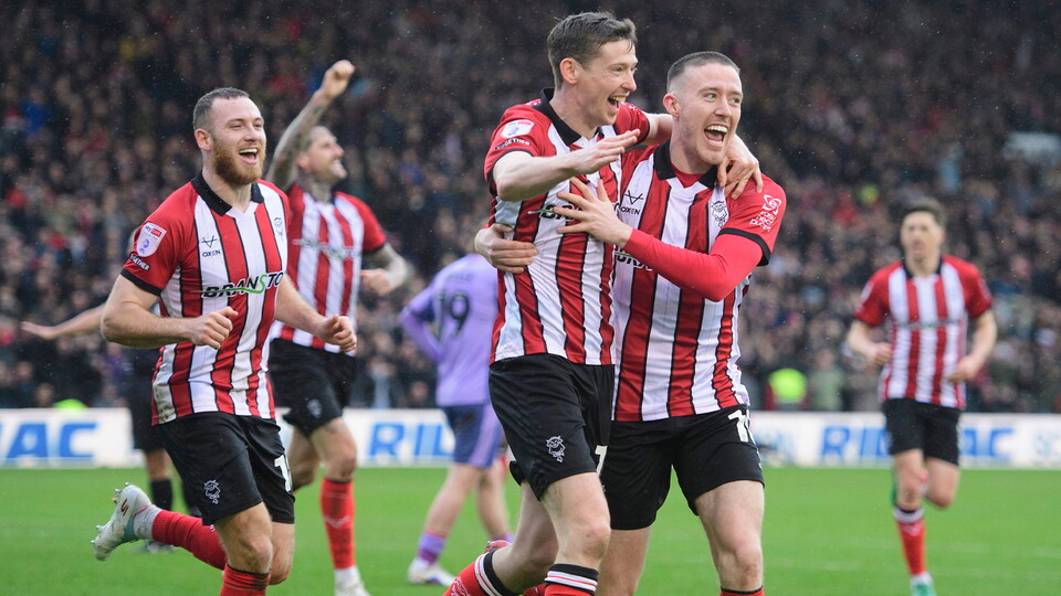 City celebrate scoring against Blackpool at the LNER Stadium