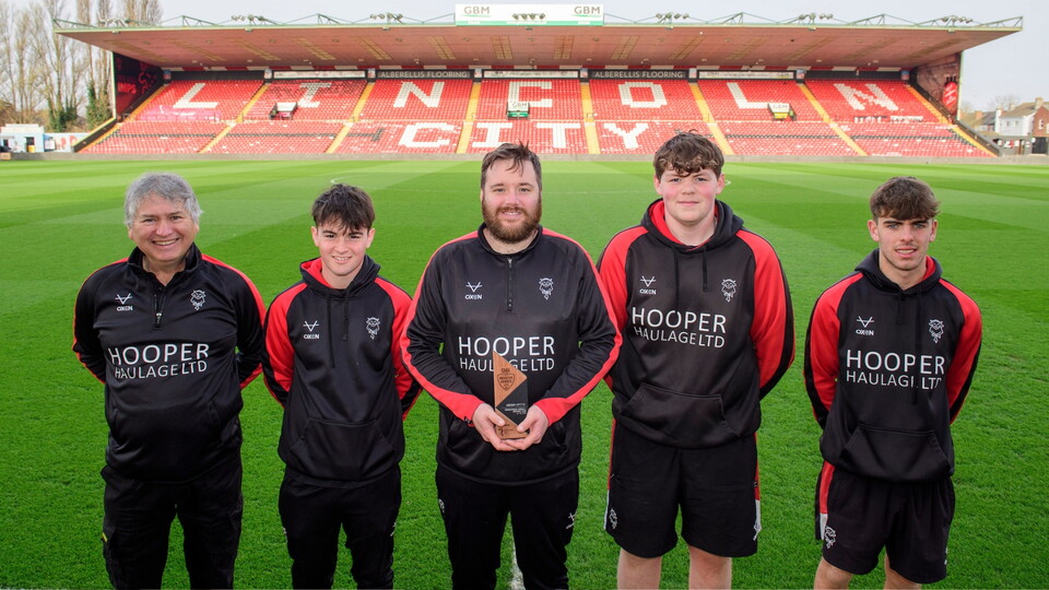 From left, Paul Willoughby, groundstaff of Lincoln City, Joe Fry, groundstaff of Lincoln City, Liam Markie, grounds manager of Lincoln City, Oscar Harrowing, groundstaff of Lincoln City and Alex Fox, groundstaff of Lincoln City with the professional football grounds team of the year award prior to the EFL Sky Bet League One match between Lincoln City and Rotherham United at LNER Stadium, Lincoln.