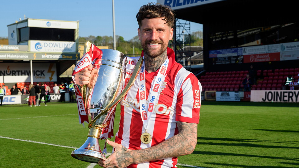 Sonny Bradley poses with the League One trophy