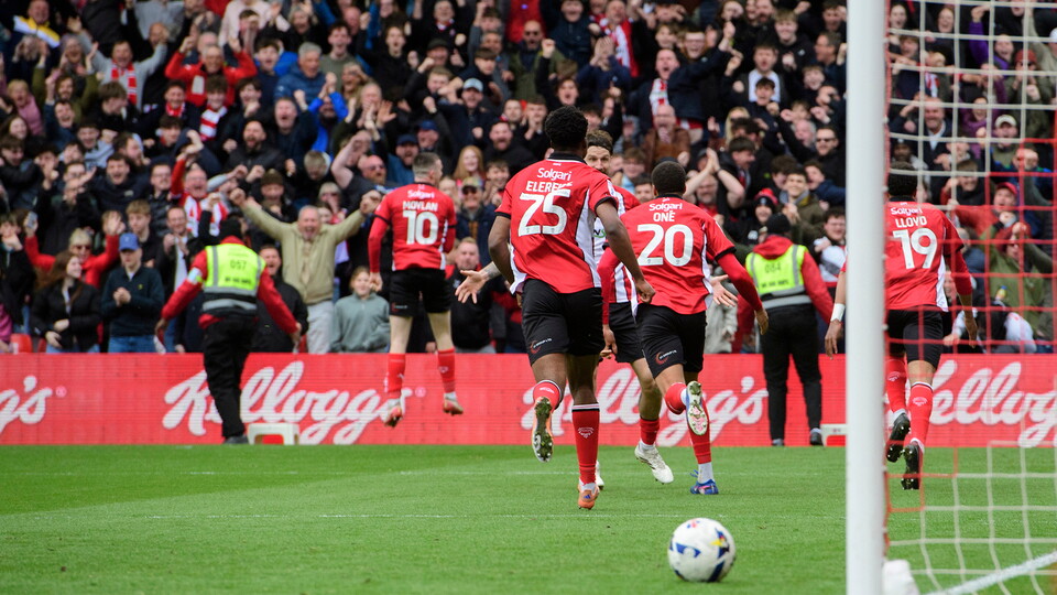 The Imps celebrate scoring against AFC Wimbledon