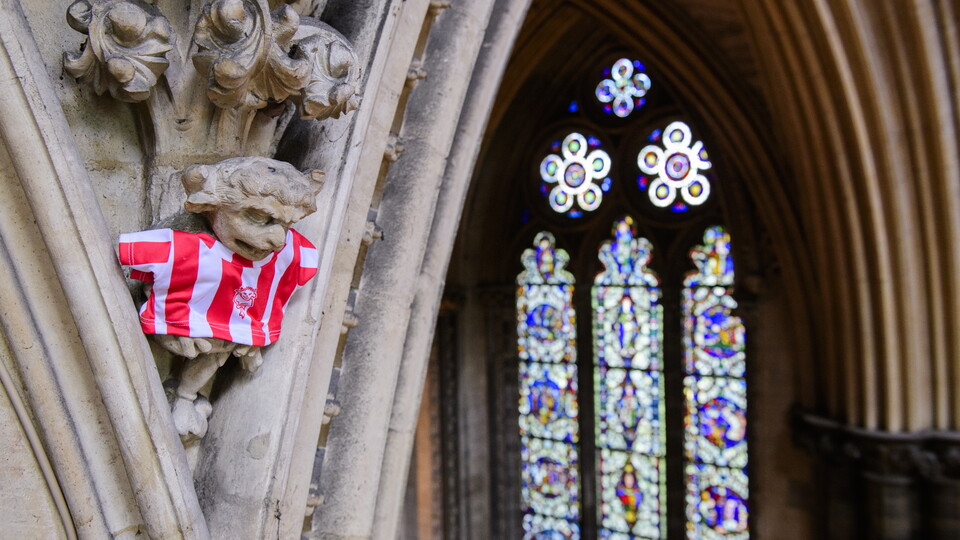 The iconic Lincoln Imp featuring a Lincoln City shirt