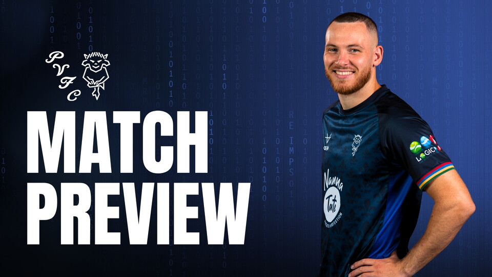A smiling man in a navy blue shirt stands confidently against a digital-themed blue background. The text 'Match Preview' is beside him.