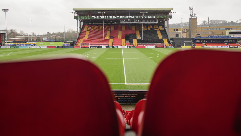 A view of the Greenlinc Stand. The view is taken from behind seats on the opposite side of the pitch.