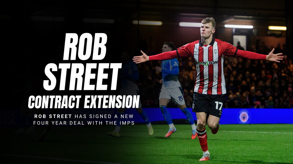 Rob Street holds his arms out celebrating a goal