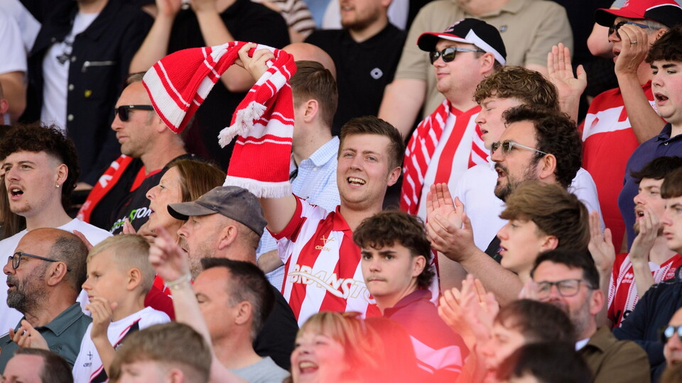 Lincoln City fans watch their team in action during the EFL Sky Bet League One match between Lincoln City and Wycombe Wanderers at LNER Stadium, Lincoln.