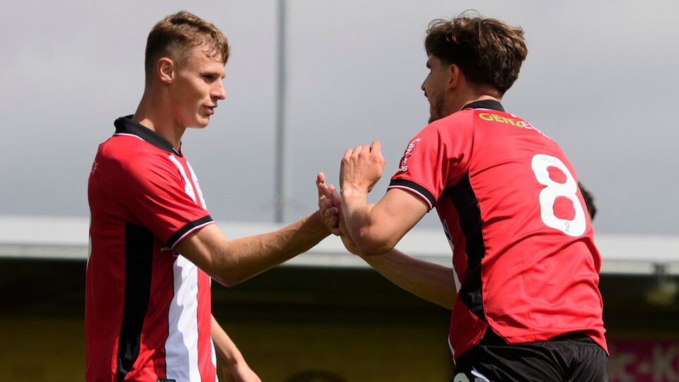 Rob Street and Tom Bayliss celebrate a goal in the pre-season win at Boston United