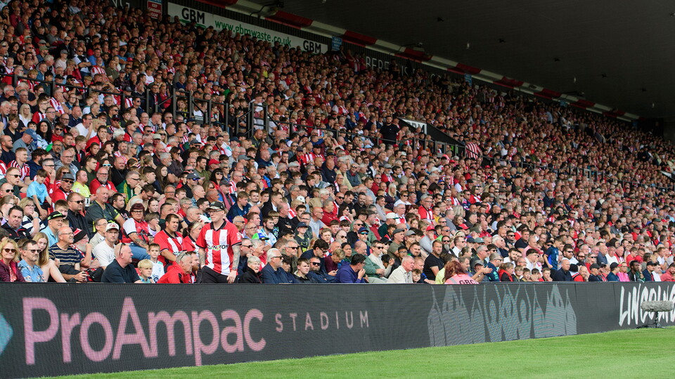 Fans in the GBM Stand at the ProAmpac Stadium