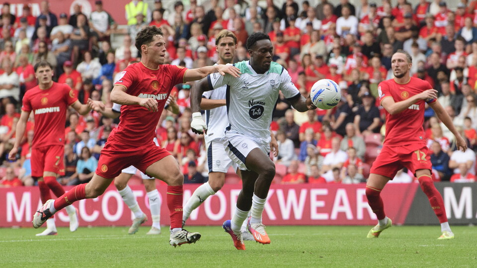 Tanto Olaofe battles for the ball with a Middlesbrough player