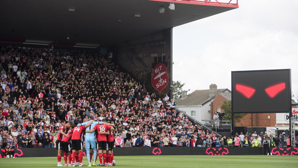 Lincoln City players in a pre-match huddle