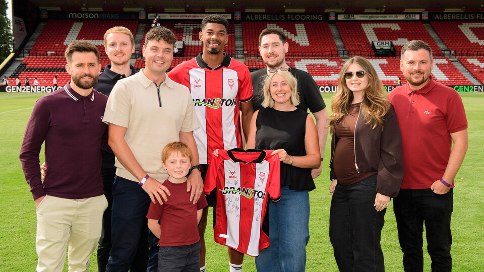 Sponsors present Reeco Hackett with the man of the match award after the Portsmouth game