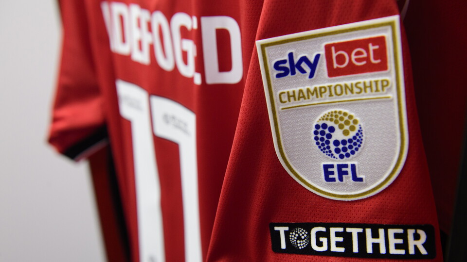 A red shirt is hung up, with Sky Bet Championship badge
