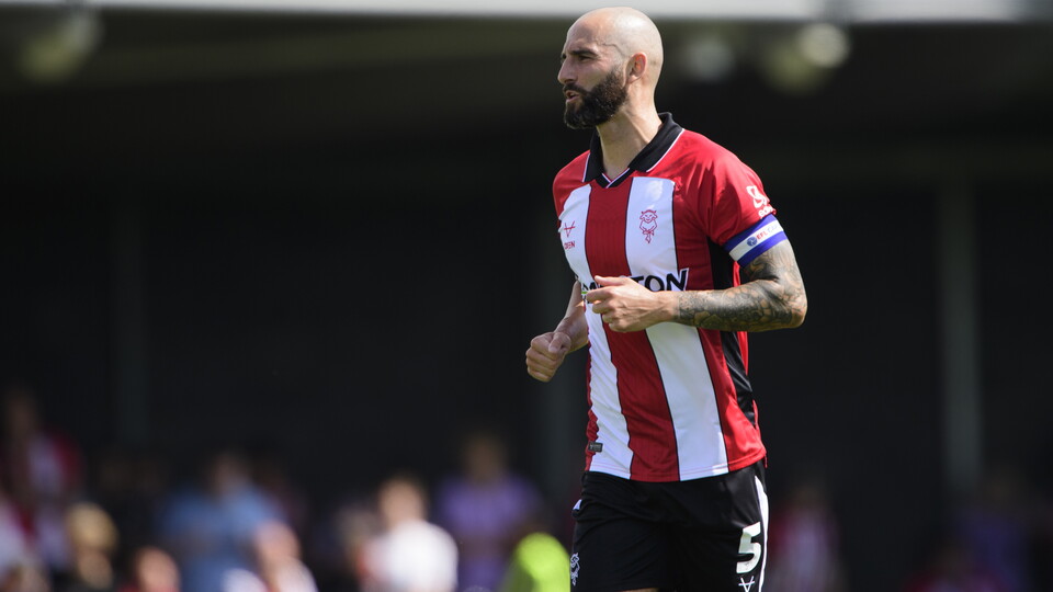 Adam Jackson wears a captain's armband
