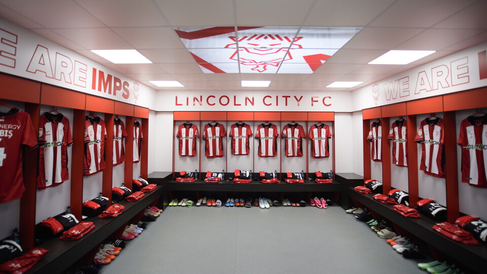 Shirts hung up in a changing room