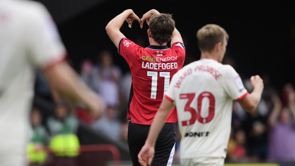 An image of the back of Mikkel Ladefoged celebrating a goal.