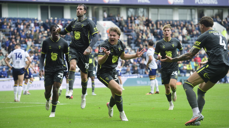 Freddie Draper runs away to celebrate after scoring a goal