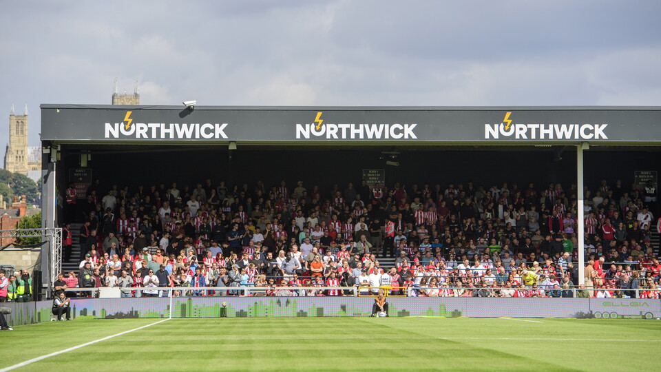 Supporters sit in the Stacey West Stand